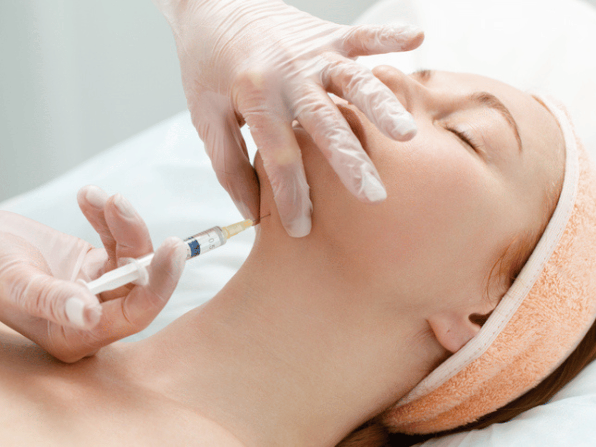 woman getting injections on her chin