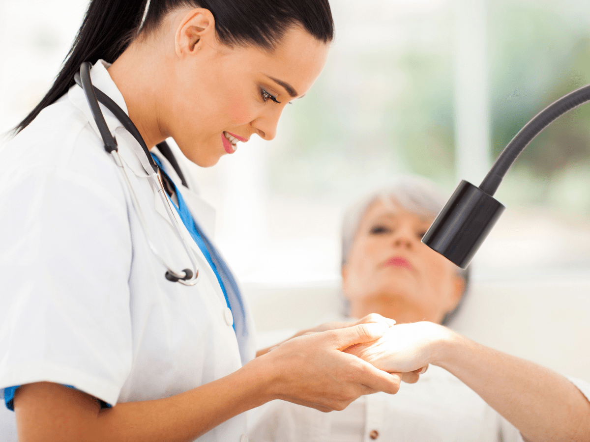 skin exam with old woman