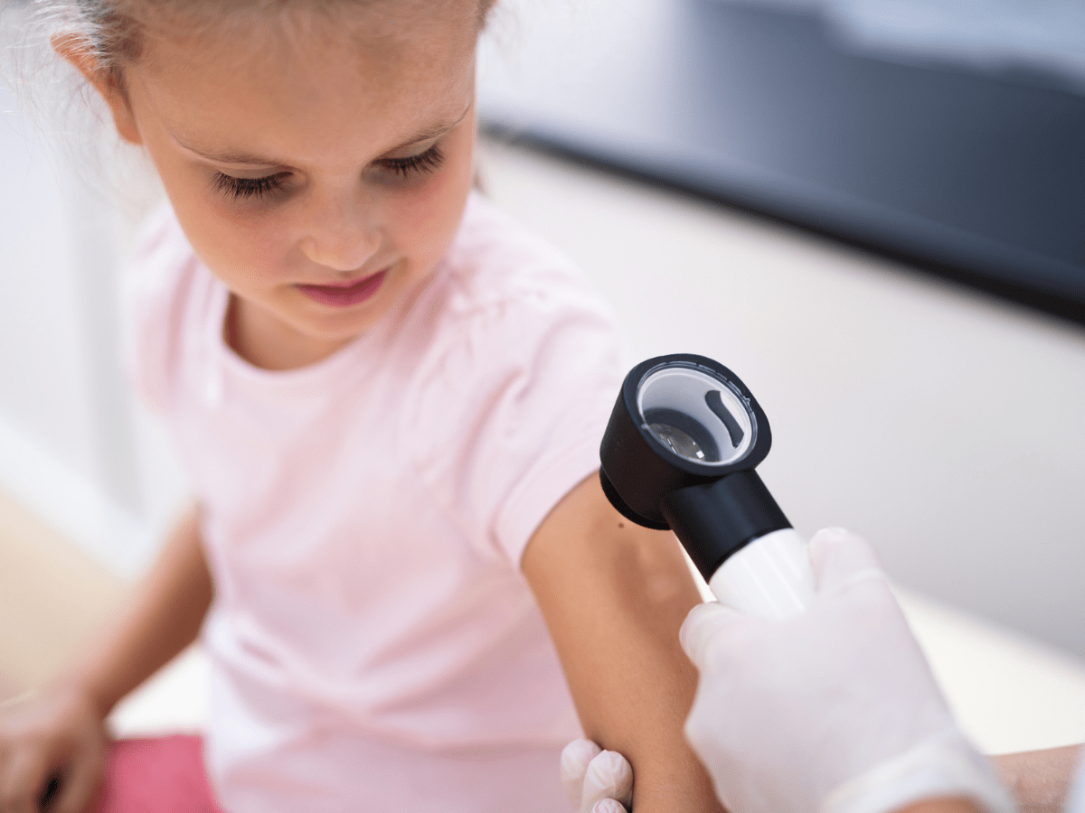 female child getting a skin exam
